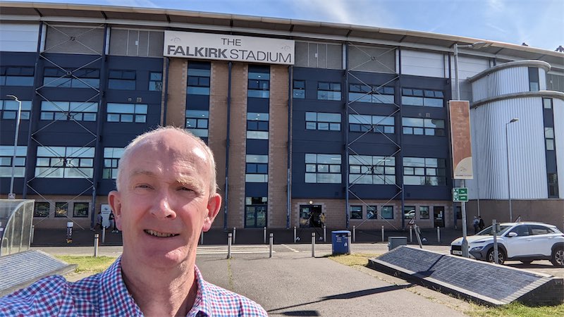 Self portait photo in front of the entrance gates at the Falkirk Football Club stadium