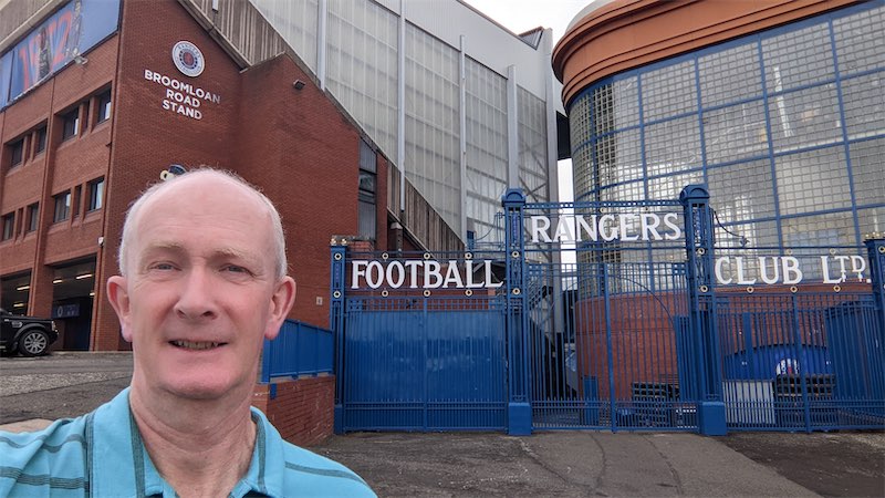 Self portait photo in front of the gates at the Rangers Football Club ground