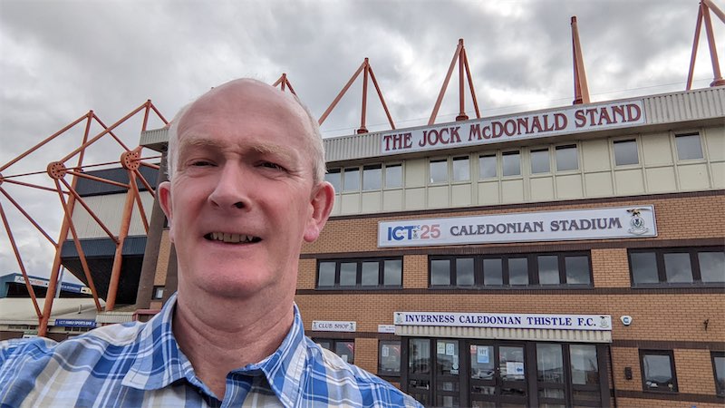 Self portait photo in front of the main entrance to the Inverness Caledonian Thistle Football Club stadium