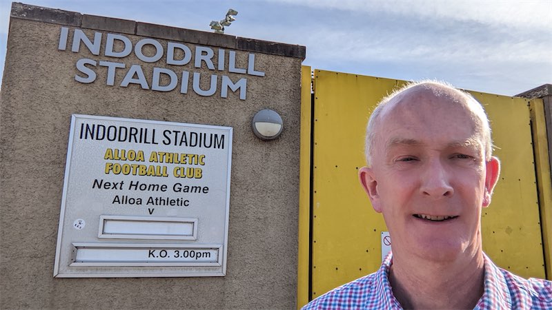 Self portait photo in front of the entrance gates at the Alloa Athletic Football Club ground
